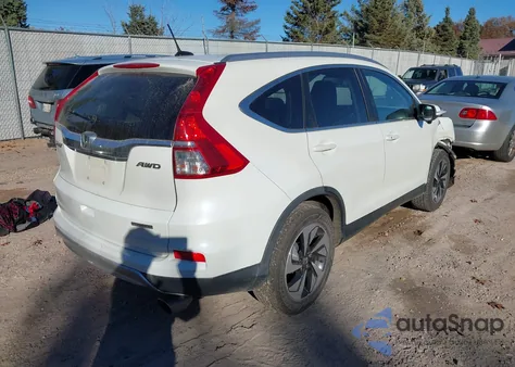 2015 Honda Cr-V Touring z USA, uszkodzony, nr VIN 5J6RM4H9XFL121982